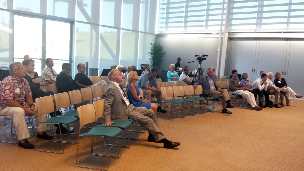 The crowd listens as Dave Girling talks about the water taxi project. — NB Indy Photo ©