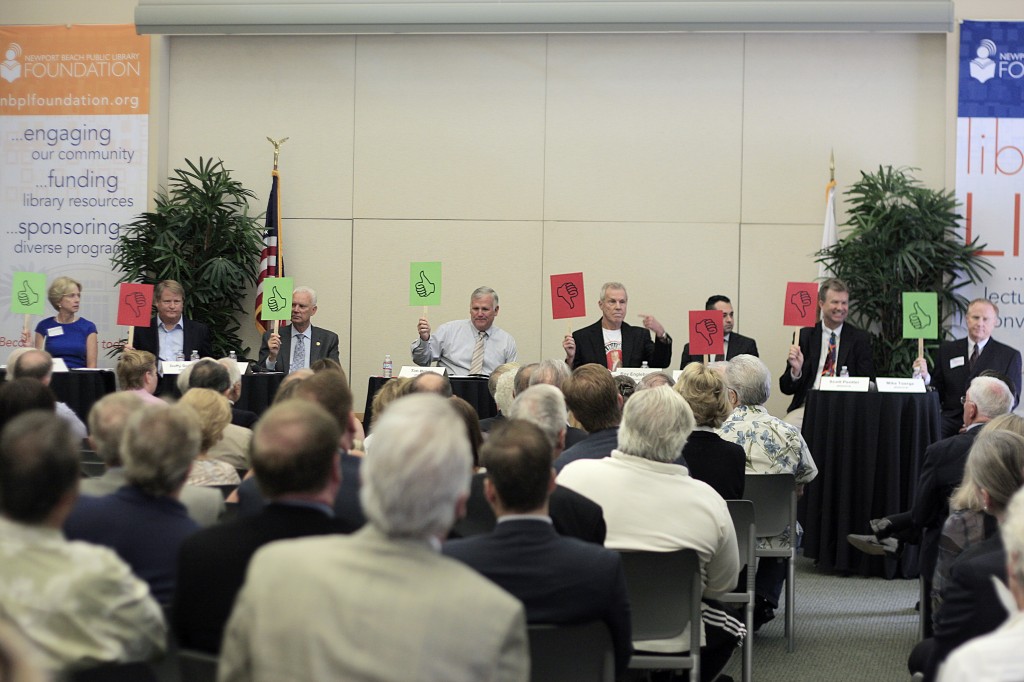 City Council candidates vote Yes or No to a question posed to them at the candidates forum Thursday. — Photo by Sara Hall © 