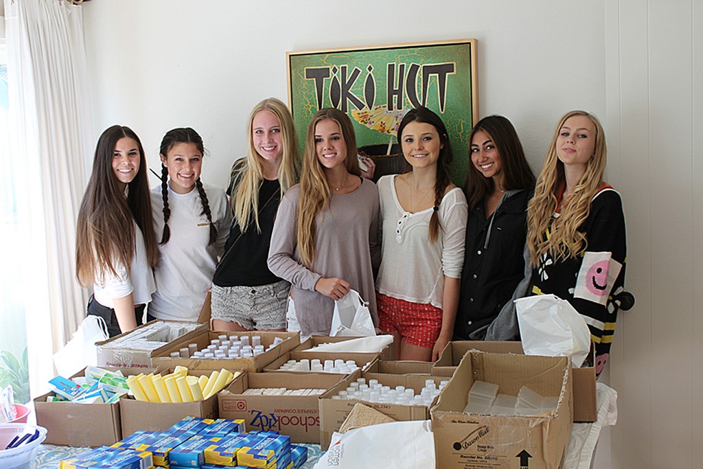 Kits 4 Kindness founder Madeline Hall and friends assemble hygiene kits. — Photo courtesy Kits 4 Kindness ©