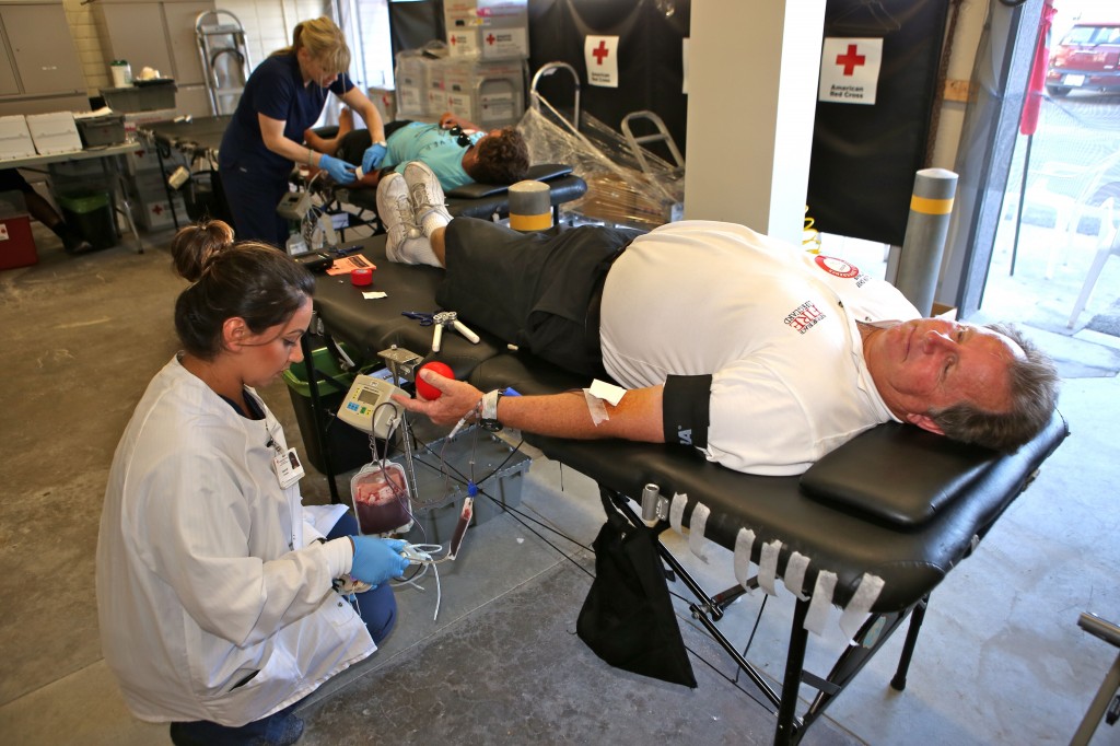 Lifeguard Battalion Chief Jim Turner gives blood during the 28th Annual Red Cross Blood Drive Wednesday at the Lifeguard Headquarters at Newport Pier.  — NB Indy Photo ©