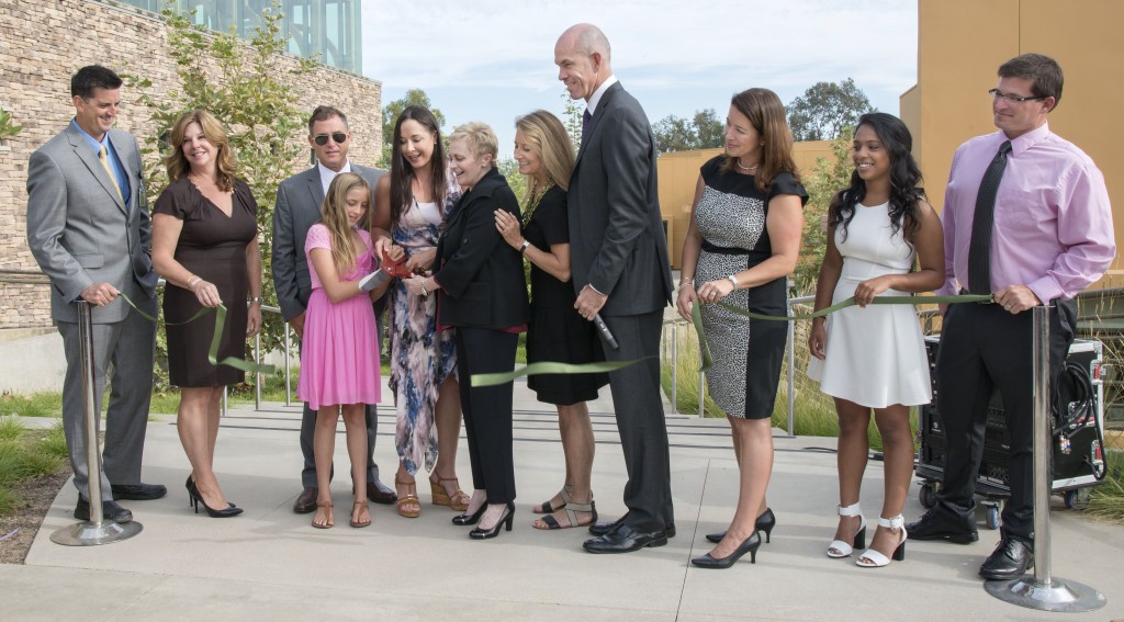 Officials cutting the ribbon to the new Lisa Argyros and Family Science Center at Sage Hill School on Monday (left to right):Sage Hill Science Department Chair Kerry Langdale, Sage Hill trustee Madaline Gordon, John Massa (Lisa Argyros’ husband), Sylvia Mitchell (Lisa Argyros’ daughter), Lisa Argyros, Chair of the Sage Hill School Board of Trustees Christy Marlin, Sage Hill trustee Vicki Booth, Sage Hill President Gordon McNeill, Sage Hill Head of School Patricia Merz, Student Body President Rachana “ChaCha” Pillai, and Sage  Hill science teacher Todd Haney. — Photo by Charles Weinberg ©