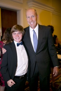 Hawken Miller, left, a duchenne muscular dystrophy patient advocate, presented Global Genes' Champion of Hope for Public Service Award to David Williams, President/CEO of Make-A-Wish America