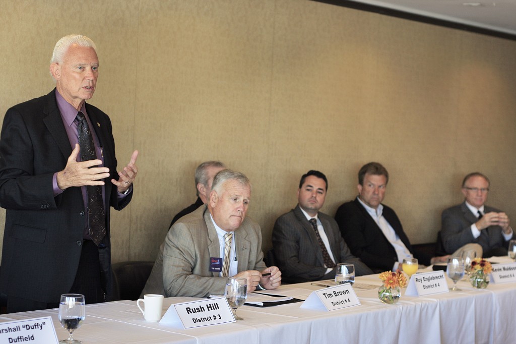 Mayor Rush Hill, running for re-election in district 3, speaks as other cndidates look on during a forum Thursday morning hosted by the Corona del Mar Chamber of Commerce at Bahia Corinthian Yacht Club. — All photos by Sara Hall ©