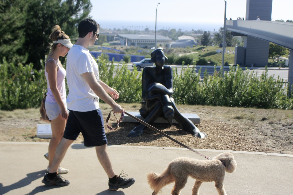 Visitors walk by Curt Brill’s Brandi sculpture during the event on Saturday. — Photo by Sara Hall ©