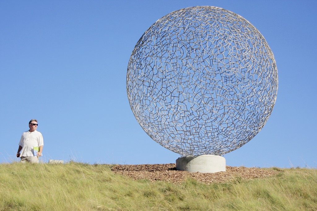 A guest checks out Ivan Mclean’s Sphere 112 during the exhibition. — Photo by Sara Hall ©