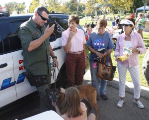 Officer Mike Fletcher and Jardo at a community event in Newport Beach