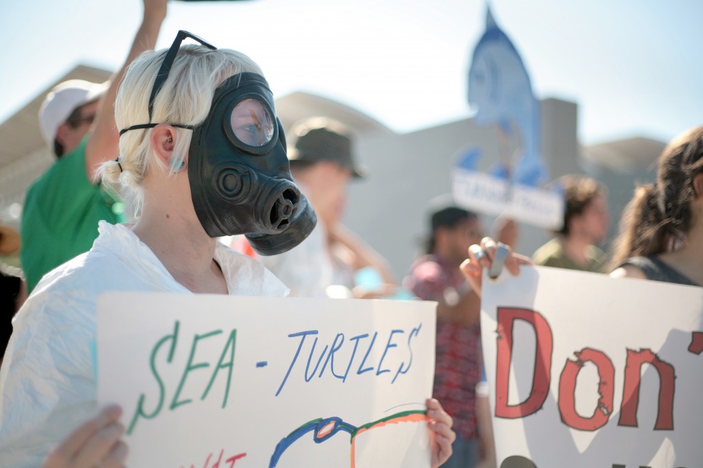 Fracking protesters donned gas masks and hazmat suits. — Photo by Sara Hall ©