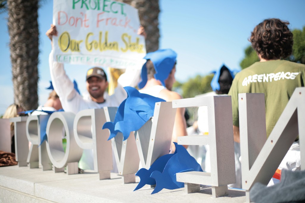 Fracking protesters wore fish hats, as well as others donning gas masks and hazmat suits, during a demonstration outside of Newport Beach Civic Center and City Hall, where CA Coastal Commission was meeting, on Wednesday. — Photo by Sara Hall ©