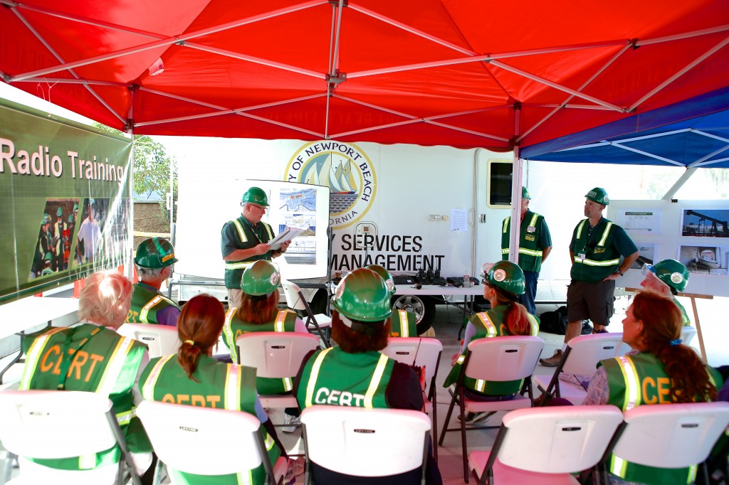 CERT volunteers listen to instructions before they learn how to use ham radios during the Drill the Skills event Saturday. — Photo by Jim Collins ©