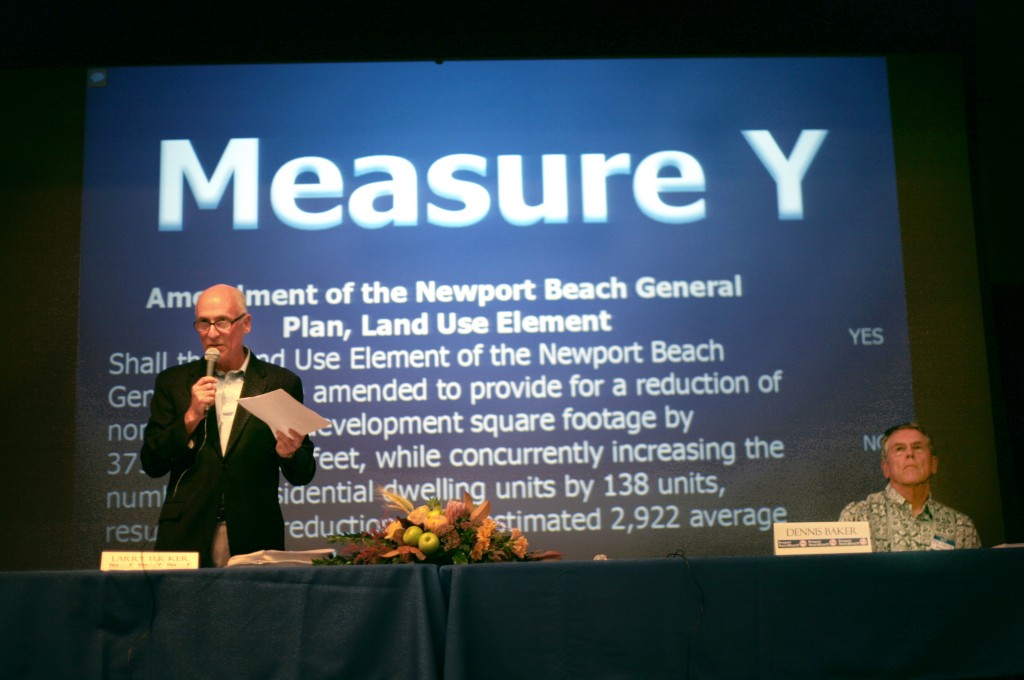 Measure Y supporter Larry Tucker speaks about the measure during the Corona del Mar Resident's Association's forum as opponent Dennis Baker listens.  — Photo by Sara Hall ©