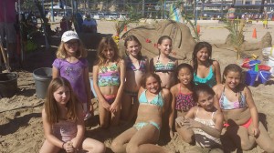 Girl Scout Troupe 731 in front of their sandy design. — Photo by Nichole Jasso