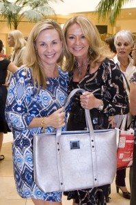 Supporters Frania Black and Naomi Edwards pose for a photo at the Angelitos de Oro Card Week Preview Day.