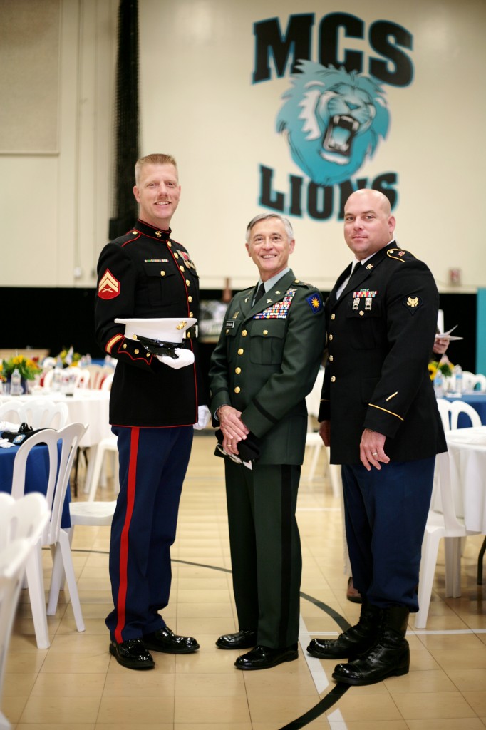 (left to right) Dwight Hanson, U.S. Marine Corps retired and MCS Boy Scouts, Mirko Duvnjak, Military Reserve Technician for the National Guard, and Steven Padilla, Marine veteran who served in Operation Iraqi Freedom, pose for a photo together during the event. — Photo by Sara Hall