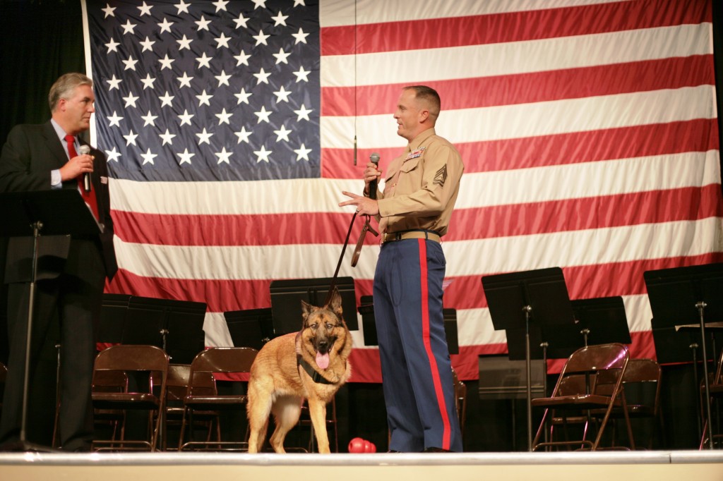 Mariners Christian Elementary Veterans Day special guests Marine Sgt. Chris Willingham and retired Marine dog, Lucca, speak with Interim Head of School Todd Perkins. — Photo by Sara Hall ©