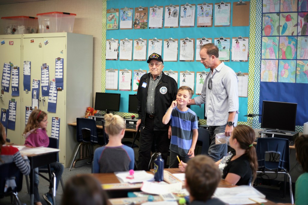 Louis Marini, 88, a WWII veteran, speaks to his graddaughter's class about his experience in the military. — Photo by Sara Hall ©