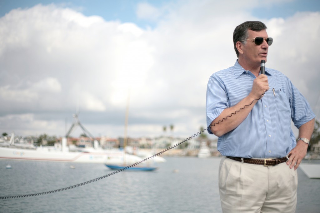 Harbor Commission Vice Chairman David Girling speaks about the 125-foot long catamaran Cheyenne (seen in the background) to a crowd during a special commission meeting and harbor tour on Saturday. — Photo by Sara Hall