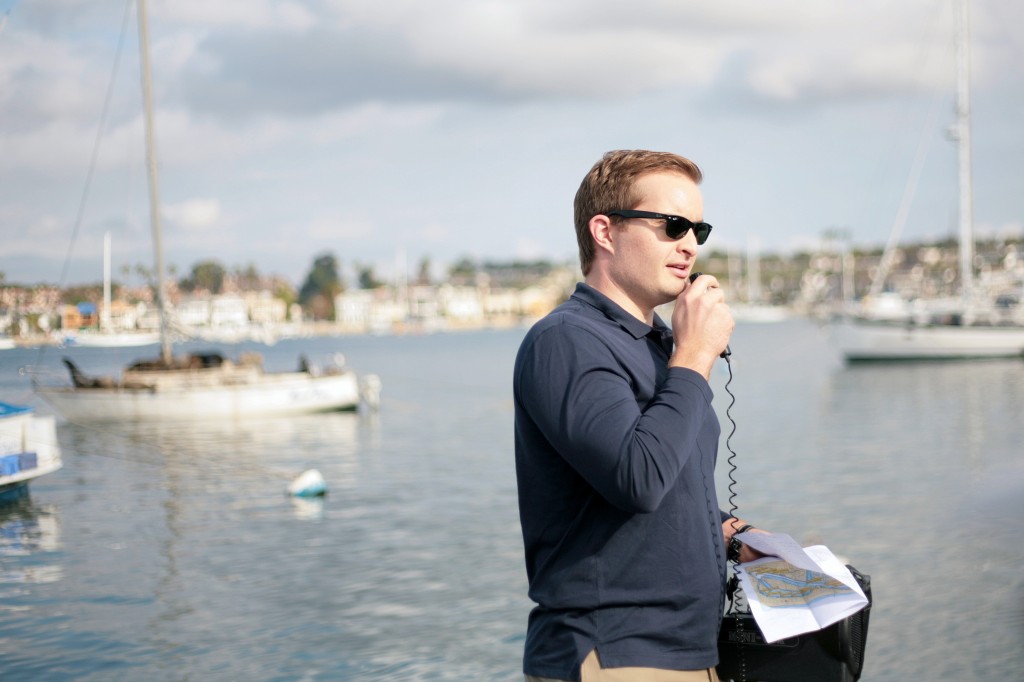 Commissioner Joe Stapleton talks about derelict vessels to the group as they cruise by one loaded down with sea lions during Saturday‘s Harbor Commission meeting. — Photo by Sara Hall