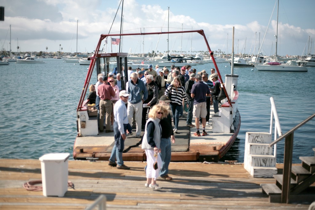 The crowd exits the ferry when the meeting/tour finished on Saturday at the Orange County Sheriff‘s Department Harbor Patrol visitor dock.   — Photo by Sara Hall