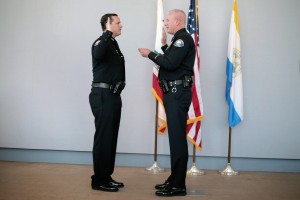 Jon Lewis gets sworn in as Newport Beach Police Department deputy chief by Lt. Jeff Brouwer.