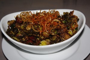 Brussels sprouts with honey, sweet potato, ham and hazelnuts