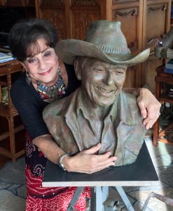 Miriam Baker with a bust of Ronald Reagan