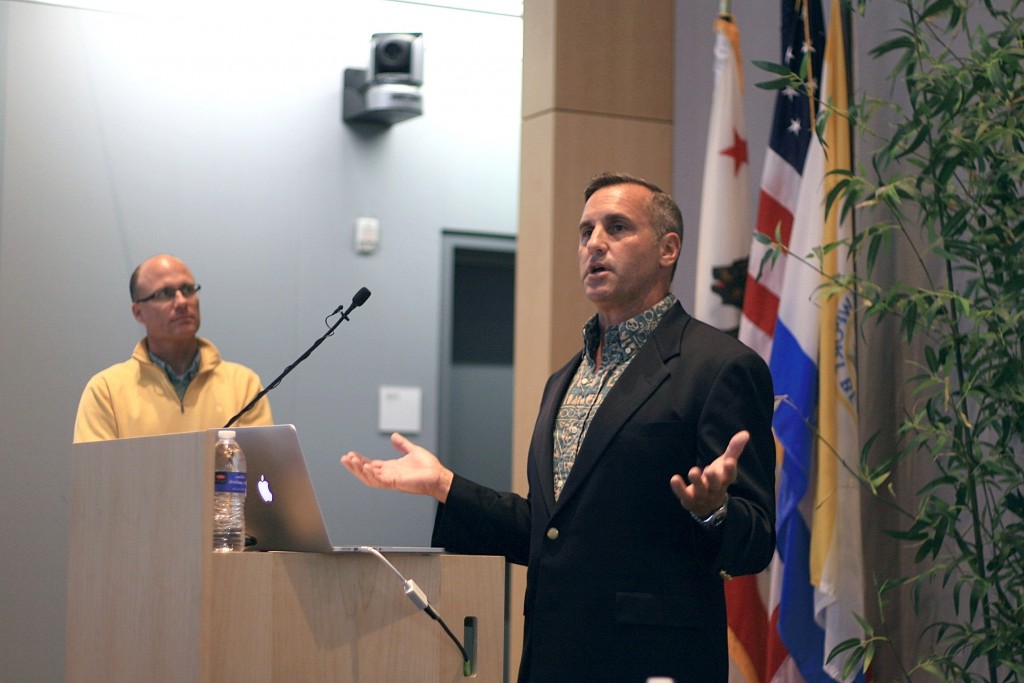 Newport Beach Harbor Commissioner Paul Blank talks about issues and projects related to the harbor as city Harbor Resources Manager Chris Miller stands in the background during Speak Up Newport’s meeting on Tuesday. — Photo by Sara Hall ©