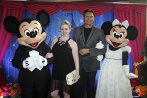 Catherine and Christopher pose with Mickey and Minnie