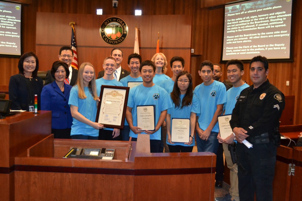 CdMHS Vest-A-Dog club members, OC Supervisors and local police officers pose for a photo after the board presented a resolution of recognition to the club. — Photo by Darla Conde