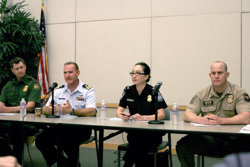 (left to right) U.S. Border Patrol agent in charge Mark Dunbar, U.S. Coast Guard Lt. Commander Beau Powers, Section Chief of Tactical Operations for U.S. Customs and Border Protection Cheryl Davies, and Director of Marine Operations for the Department of Homeland Security, Customs and Border Protection, and the Office of Air and Marine Jeremy Thompson, speak at Newport Beach Chamber of Commerce’s Wake Up! Newport meeting on Thursday. — Photo by Sara Hall ©