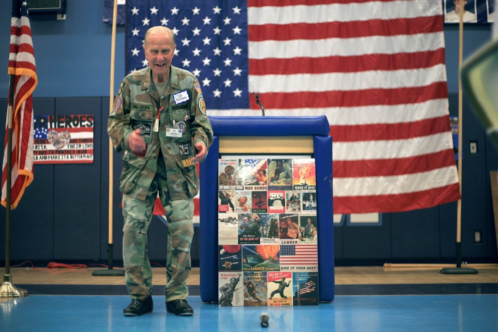 WWII veteran Sid Hallburn performs a tap dance routine for the students and his fellow veterans during the event.  — Photo by Sara Hall ©