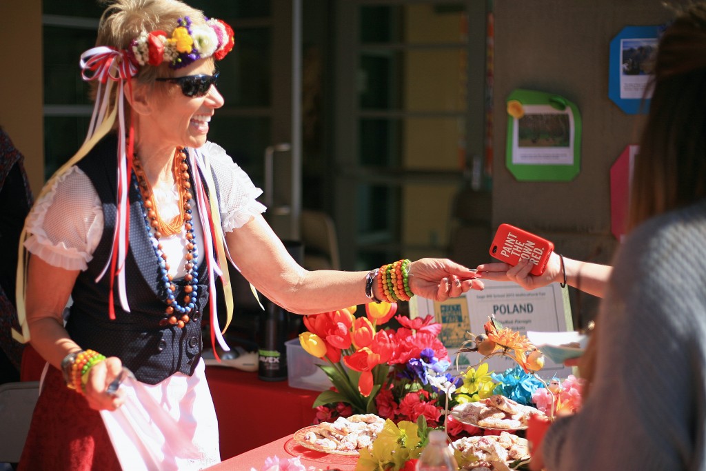 Volunteer mom Bernadette Senn works the Poland food booth, a new addition to the culinary world tour this year.  — Photo by Sara Hall ©