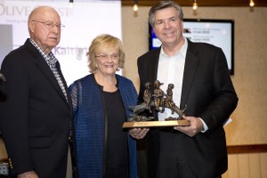 Olive Crest founders Dr. Donald and Lois Verleur presenting Food4Less President Bryan Kaltenbach with the nonprofit's inaugural Founders Award / Carla Rhea Photography