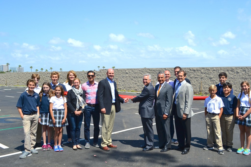 Harbor Day School Head of School Dan Greenwood prepares to cut the ribbon with student council, Newport Beach City Councilman Tony Petros and members of the board of trustees. — Photo courtesy Harbor Day School 