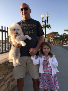 Wrigley is the center of attention for five-year-old Katerina Zynda, posed with her dad, Kevin.