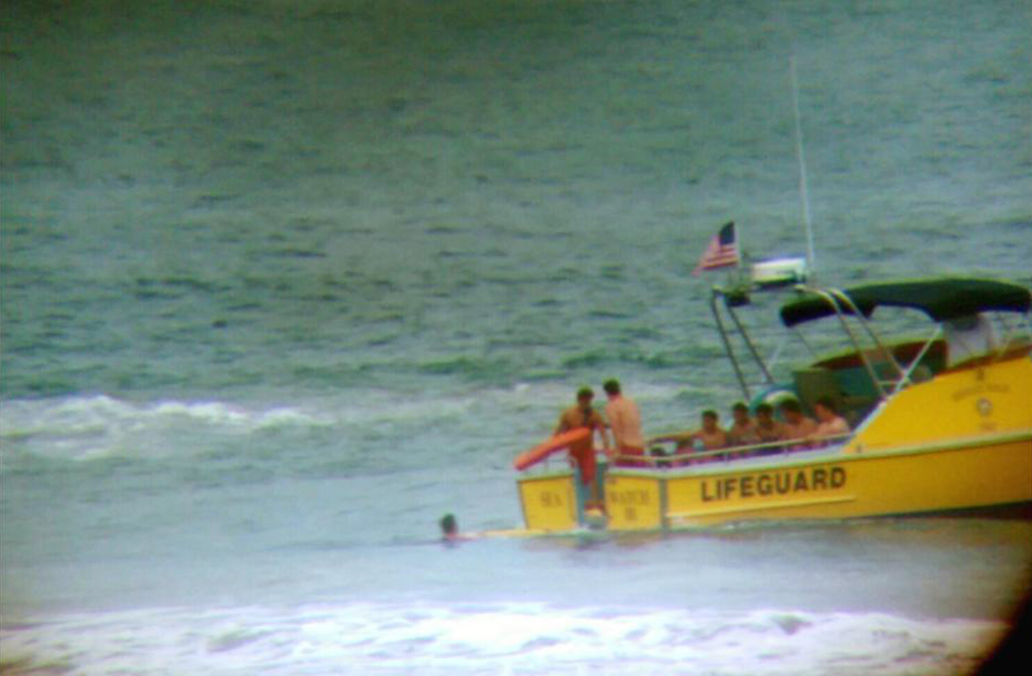 The Lifeguard Rescue Boat, with several youth safely on board, near Lifeguard Tower 18. — Photo courtesy the Newport Beach Fire Department ©