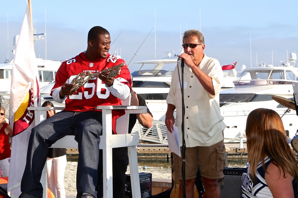 Newport Beach Mayor Ed Selich gives the key to the city to 2015 Mr. Irrelevant, Gerald Christian. — Photo by Jim Collins ©