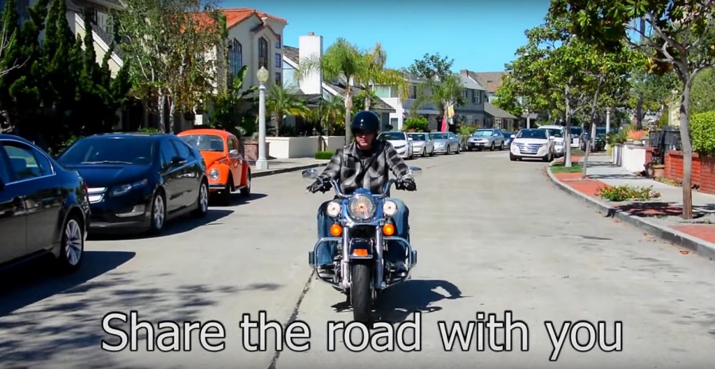 Lt. Jeff Brouwer riding a motorcycle in the NBPD’s new PSA video about sharing the road.  — NBPD “Share the Road” YouTube video screenshot © 