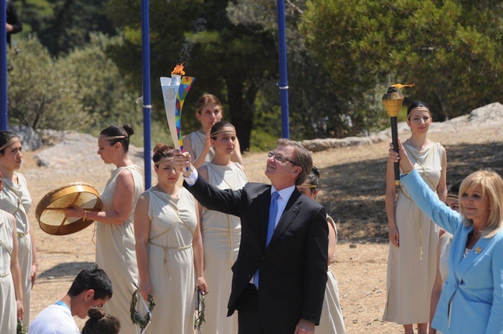 At the Torch Lighting Ceremony in Athens, Greece, Patrick McClenahan, Special Olympics World Games Los Angeles 2015 (LA2015), and Joanna Despotopoulou, Special Olympics Hellas President, stand with the Flame of Hope at Sacred Site of Pnyx. — Photo by Vassilis Koutromanos/Courtesy Special Olympics