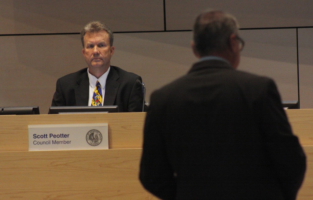 Newport Beach City Councilman Scott Peotter listens to Kevin O'Grady, the executive director of the LGBT Center OC, address the council at Tuesday’s City Council meeting. — Photo by Christopher Trela ©