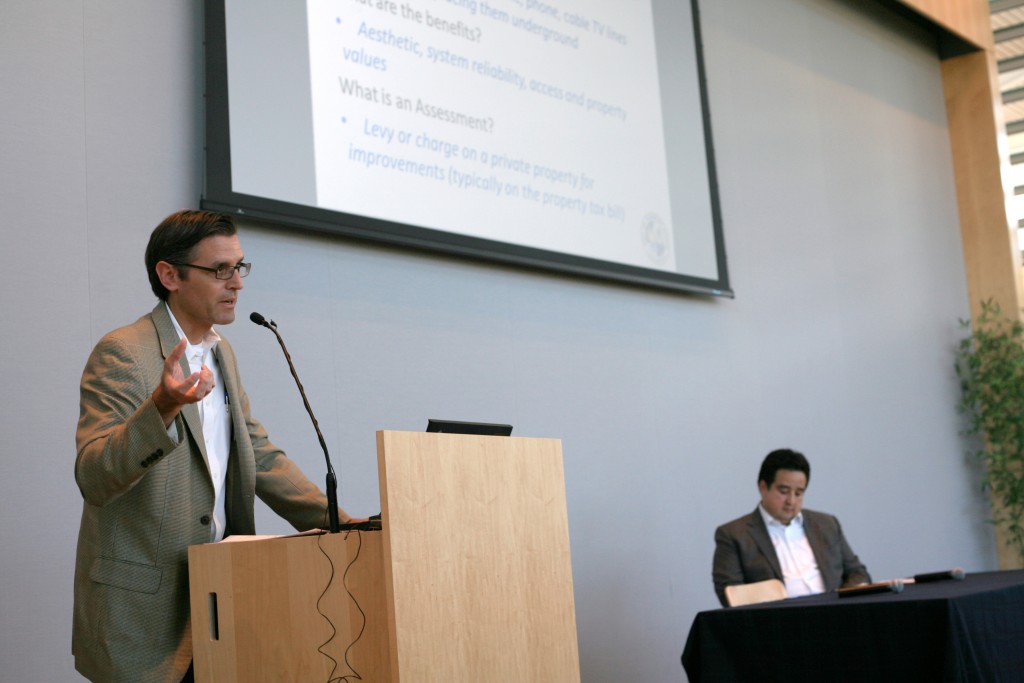 Newport Beach Deputy Public Works Director and City Engineer Mark Vukojevic talks about undergrounding utilities as Southern California Edison Regional Director of Public Affairs Larry Labrado looks on in the background during Wednesday’s Speak Up Newport’s meeting. — Photo by Sara Hall ©