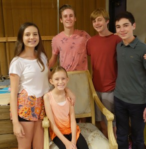 Newport Beach cast members Tessa Taylor, Christopher Huntley, Mitchell Huntley, Jaden Fogel, and Aoife McEvoy (seated)