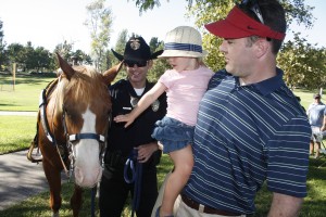 Officer Shawn Dugan and his horse Levi greet visitors to National Night Ouit