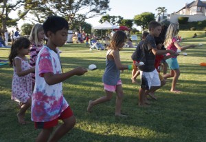 Kids enjoy an egg race during the Spyglass Hill National Night Out