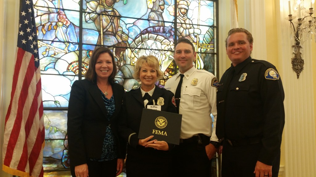 (from left to right) Donna Boston form the Orange County Operational Area, Brenda Emrick from Costa Mesa Fire Department, Brevyn Mettler from Huntington Beach FD, and Newport Beach CERT program leader and NBFD Life Safety Specialist Matt Brisbois in Washington DC accepting the 2015 FEMA Individual and Community Preparedness Award for Outstanding CERT Program Initiatives on behalf of Orange County CERT Mutual Aid Program. — Photo courtesy Matt Brisbois ©