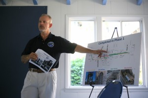 Project Manager Don Cutler talks about the Mariner’s Mile sewer pipe construction project during a community meeting on Saturday.