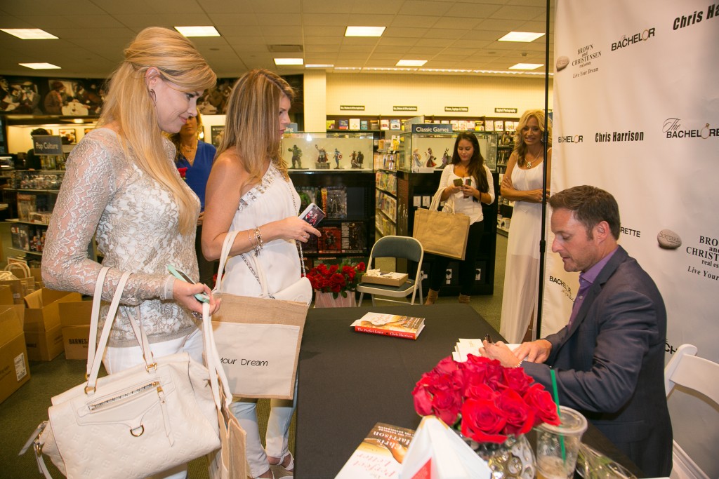 Local residents Debra Klein and Bree Cox with Chris Harrison. — NB Indy Photo ©