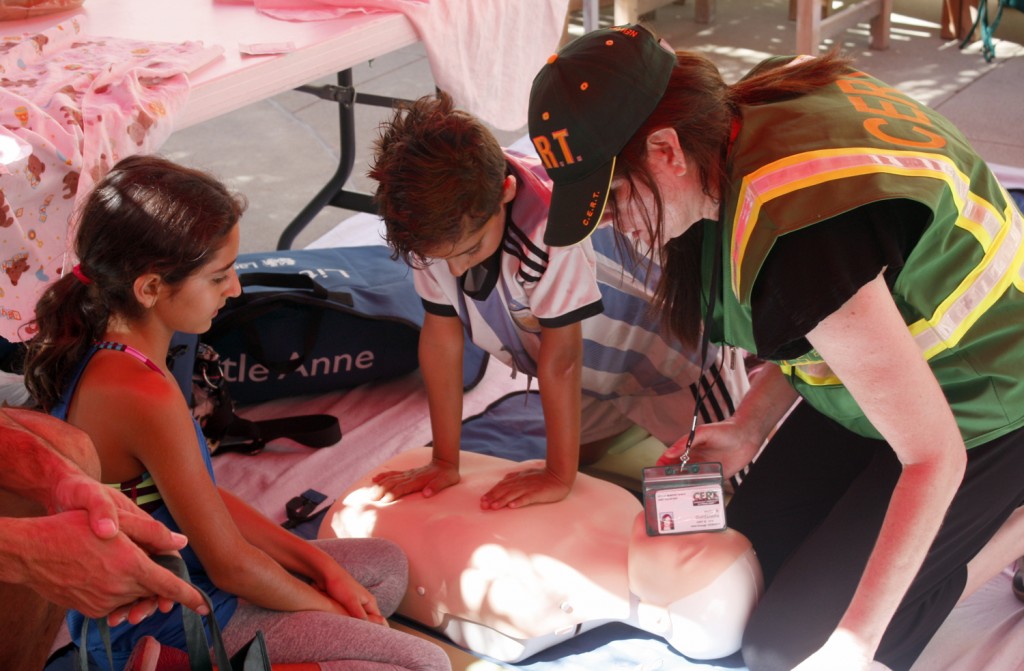 Kids get a lesson in CPR at the Preparedness Expo on Saturday. — Photo by Christopher Trela ©