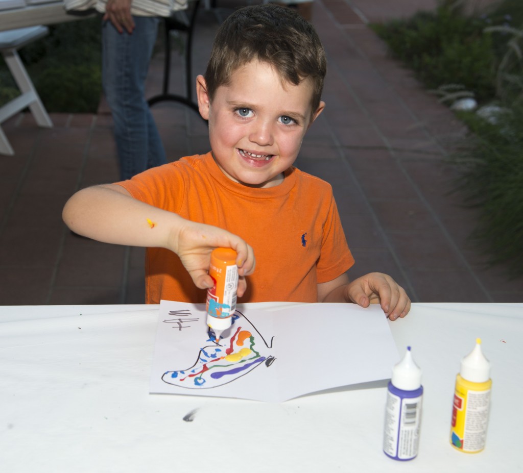 Max Buccola, 4, painting during the event.  — Photo by Lawrence Sherwin ©