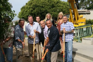 The team from Arbor Real Estate helps Mayor Ed Selich and Council Member Tony Petros plant a new coral tree in Ensign View Park 