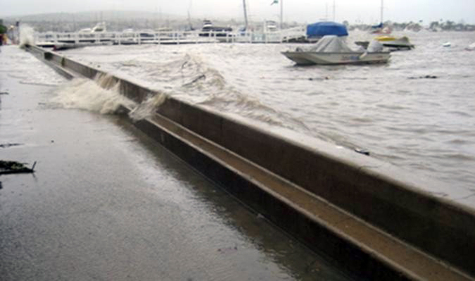 Water breaching a Balboa Island seawall in 2010. — Photo courtesy of city of Newport Beach